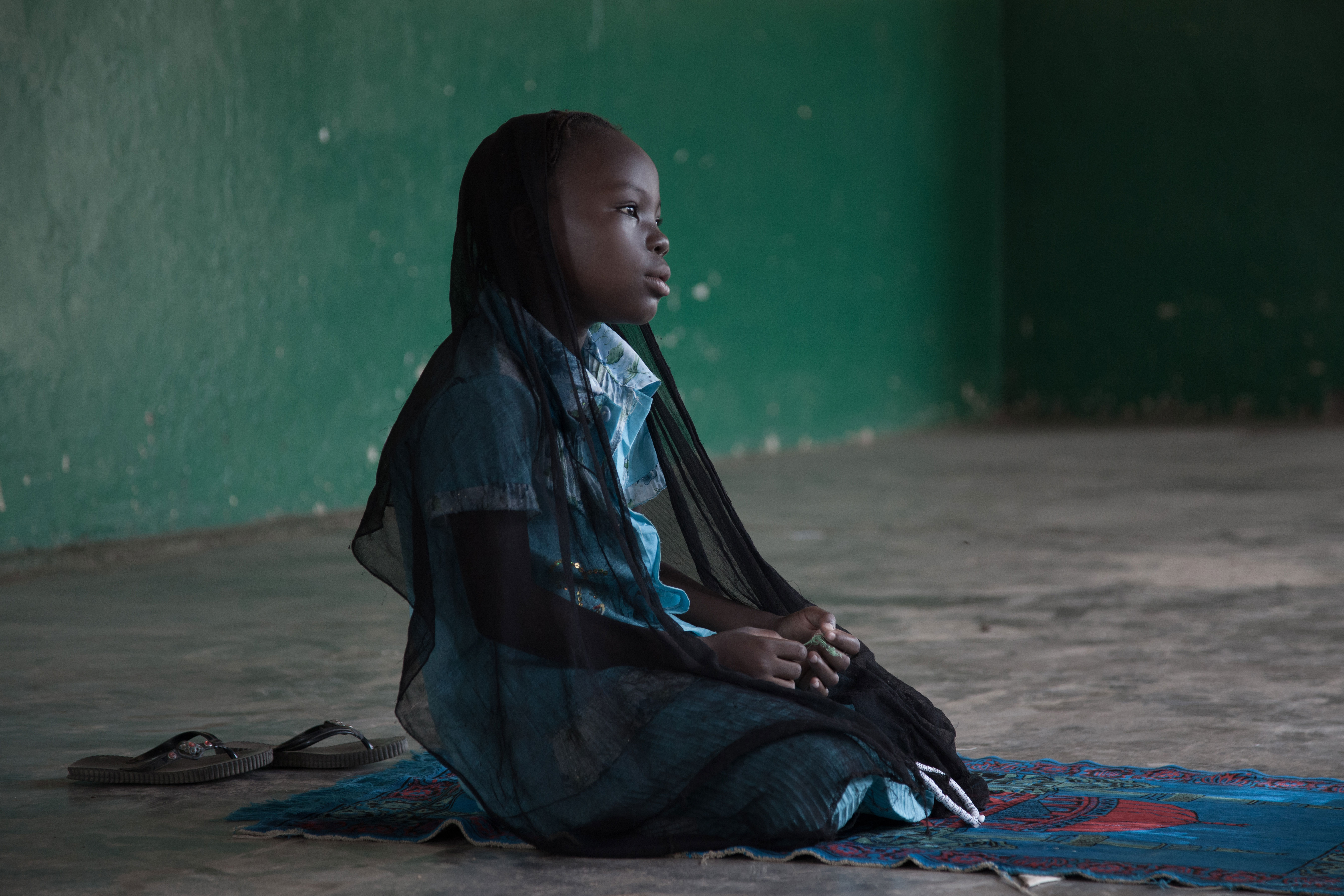 Girl praying at the Mosque, PK5 Quarter, Bangui, Central African Republic